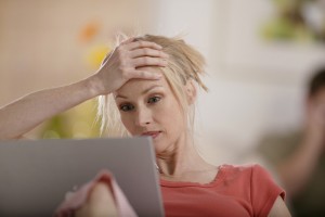Frustrated woman at computer